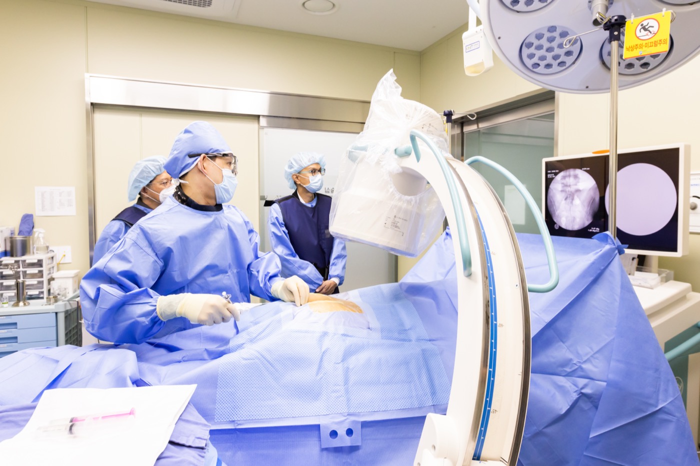 Professional surgical procedure with C-arm fluoroscopy